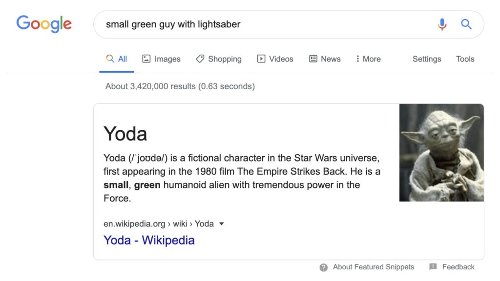 Kết quả tìm kiếm Google với truy vấn “small green guy with lightsaber”, hiển thị thông tin nhân vật Yoda từ Star Wars.