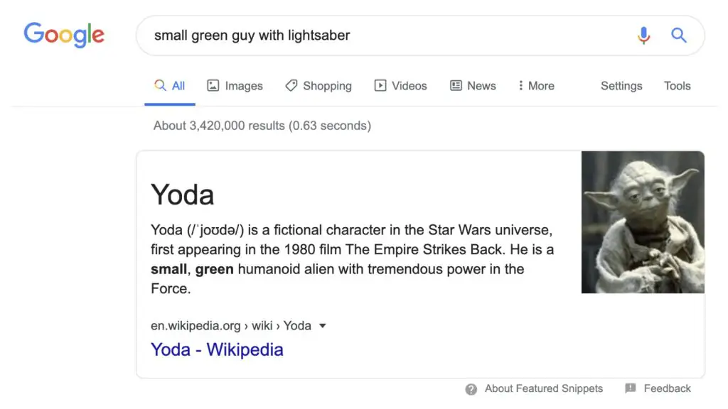 Kết quả tìm kiếm Google với truy vấn “small green guy with lightsaber”, hiển thị thông tin nhân vật Yoda từ Star Wars.